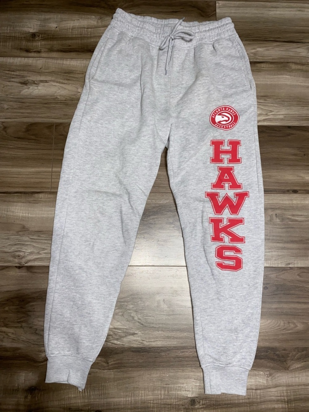 NBA Gray Sweatpants with Pockets. Red Hawks Lettering